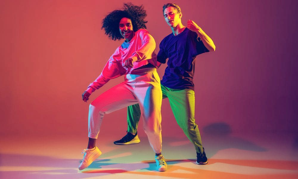 dance-time-stylish-men-woman-dancing-hip-hop-bright-clothes-green-background-dance-hall-neon-light